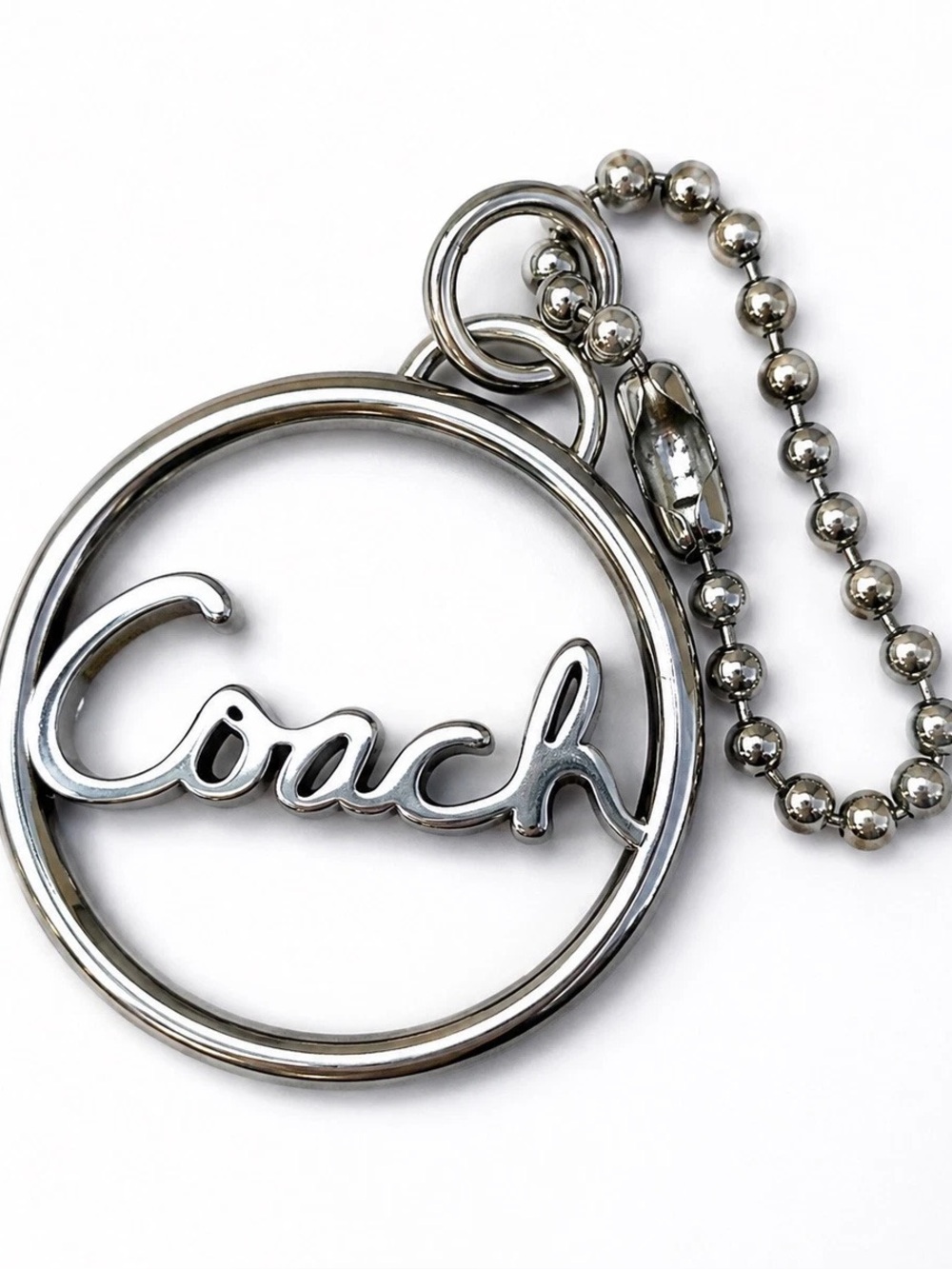 Coach 1.5" silver-tone hang tag fob script logo circular metal frame ball chain